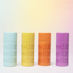 Load image into Gallery viewer, A full product shot of Nӧz Sunscreen in blue, yellow, orange, &amp; purple
