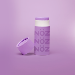 A full stand alone product shot of Nӧz Sunscreen in purple