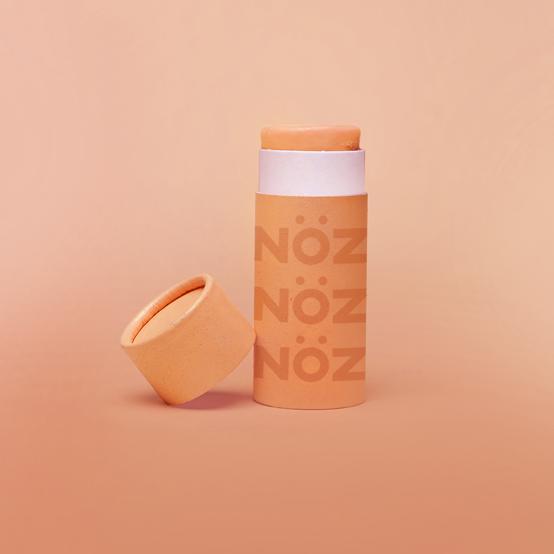 A full stand alone product shot of Nӧz Sunscreen in orange