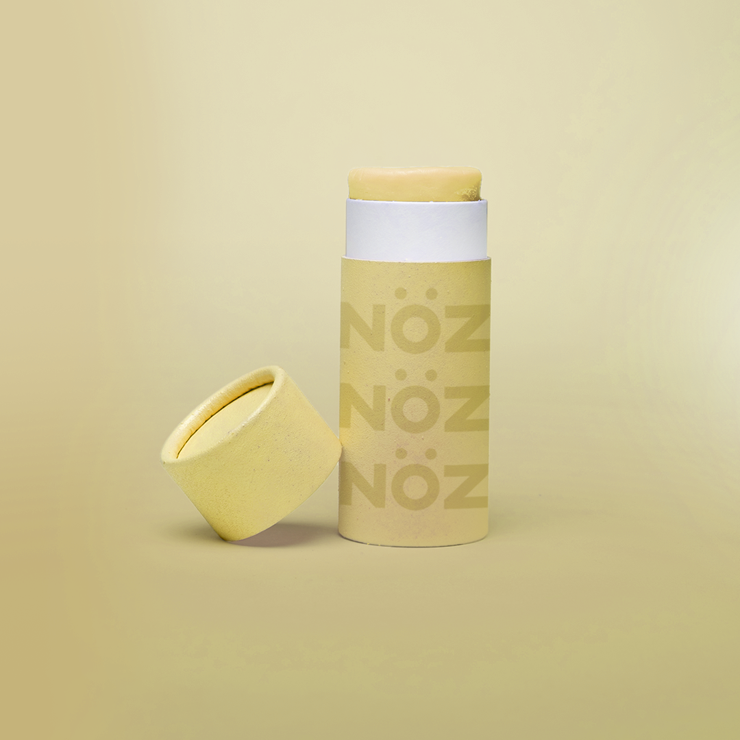 A full stand alone product shot of Nӧz Sunscreen in yellow